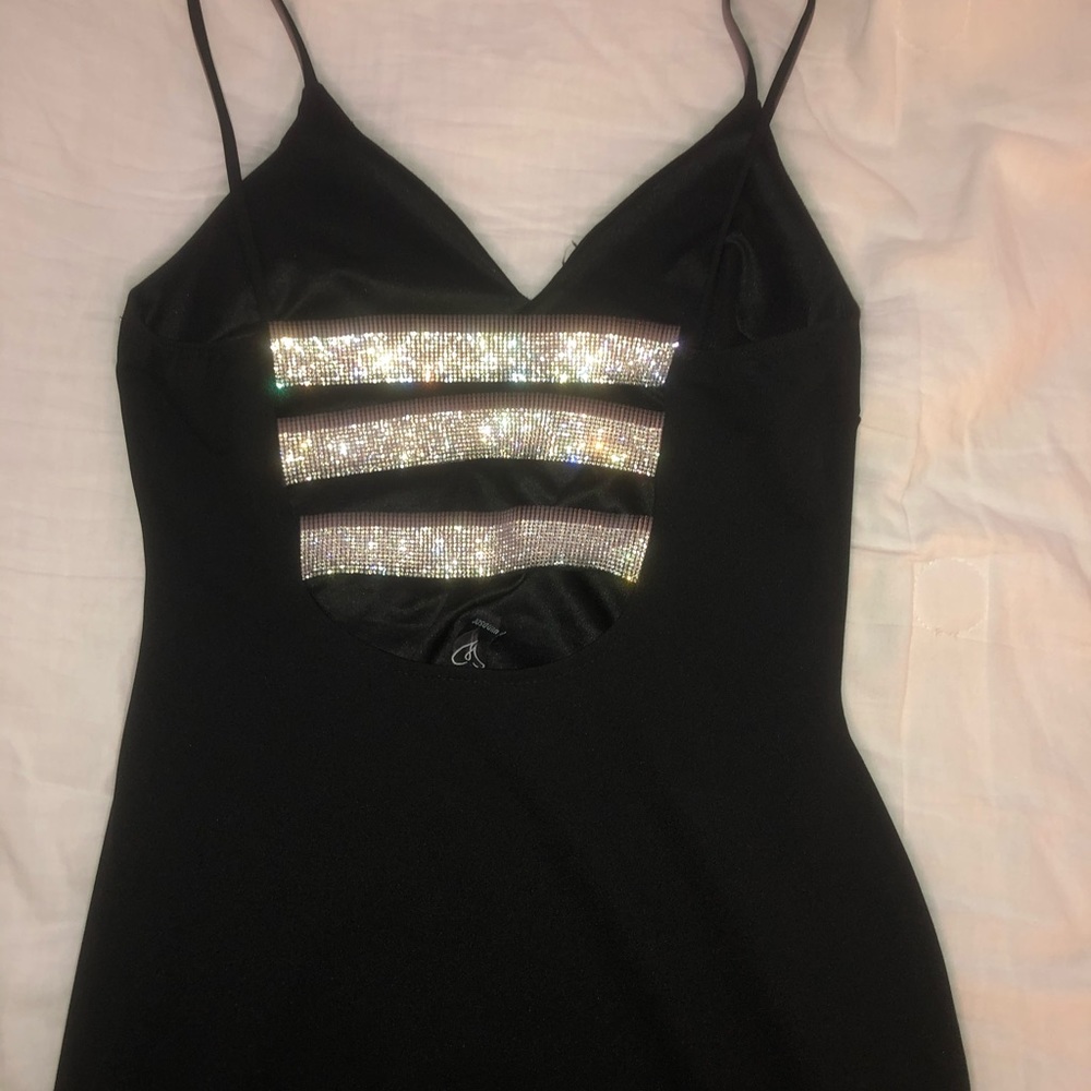 Black dress with a diamond back.